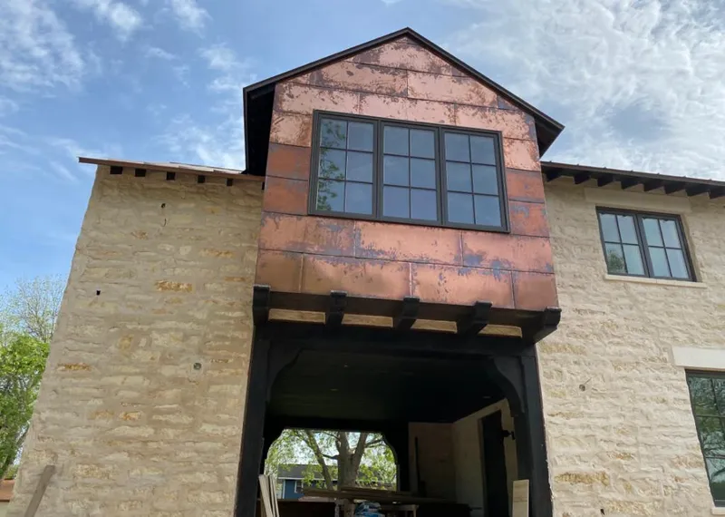Copper metal panel facade on a stone building for Skylight Installation in Pittsgrove