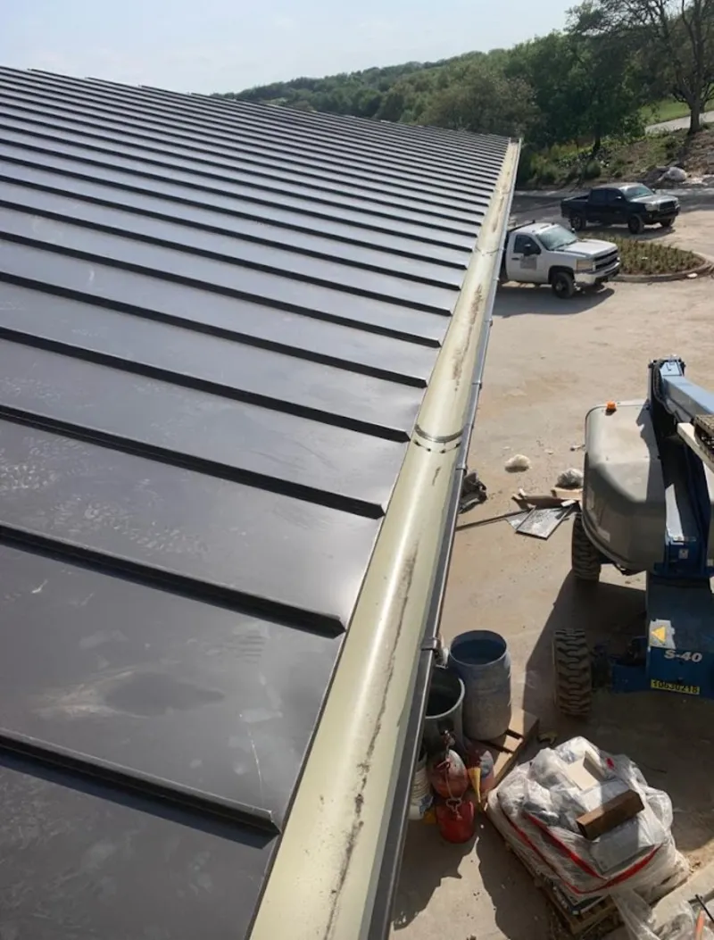 Standing seam panel and gutter detail on a metal roofing jobsite in Pittsgrove